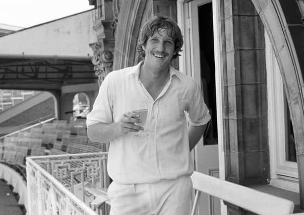 England's Ian Botham celebrates with a drink and a cigarette after taking eight wickets for 34 runs in Pakistan's second innings during 1978. Pic by PA.