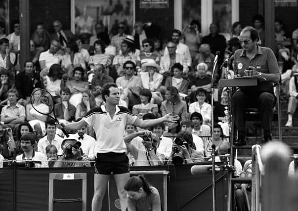 Explosive American tennis star John McEnroe holding up play in the final of the Stella Artois championship at Queen's Club by arguing with the umpire who he called a "moron". McEnroe went on the beat his compatriot Leif Shiras 6-1, 3-6, 6-2 in 1984. Pic by PA.