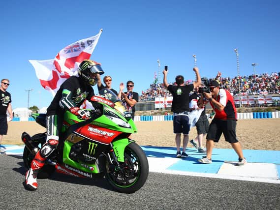 Jonathan Rea with the Northern Ireland flag following his maiden World Superbike title victory at Jerez in Spain in 2015.