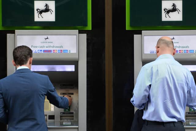 Members of the public using cash machines