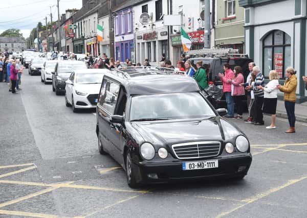 The hearse with the body of Detective Garda Colm Horkan arrives in Ballaghaderreen in County Roscommon on Friday evening