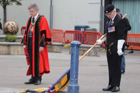 A moment of reflection with the Mayor of Causeway Coast and Glens Borough Council Alderman Mark Fielding and Standard Bearer Keith Charr during a short service held in Coleraine town centre