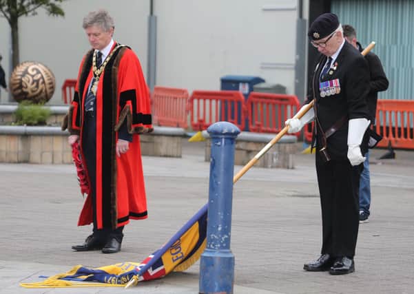 A moment of reflection with the Mayor of Causeway Coast and Glens Borough Council Alderman Mark Fielding and Standard Bearer Keith Charr during a short service held in Coleraine town centre