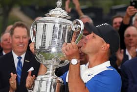 Brooks Koepka kisses the Wanamaker Trophy last year at the Bethpage Black course. Pic by Getty.