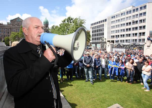 Ken Wilkinson addresses a loyalist rally in 2011 at Belfast City Hall
