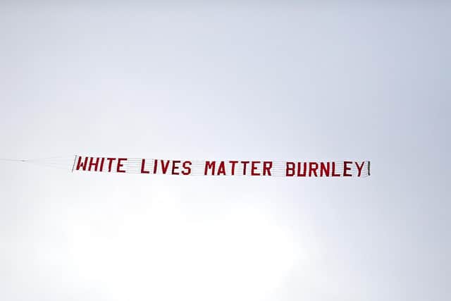 The banner appeared at the same time players from both Manchester City and Burnley FC knelt on one knee to send a message of support for the Premier League's Black Lives Matter initiative.