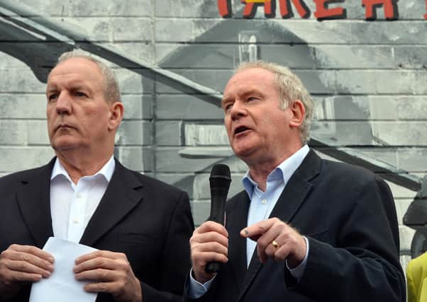 Bobby Storey with Martin McGuinness at a protest on the Falls Road, west Belfast in 2014, over the arrest of Gerry Adams
