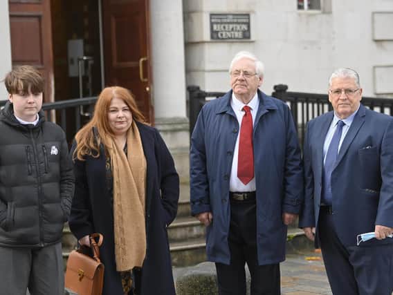Relatives of Omagh bomb victims (left-right) Flynn Wilkinson, Cat Wilkinson, Michael Gallagher and Stanley McComb arrive at Belfast High Court ahead of the full judgment in the Omagh bomb judicial review.