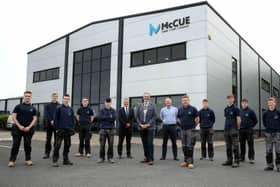Cllr William McCaughey with Graham Whitehurst MBE, Chair of the Mid and East Antrim Manufacturing Taskforce, Gary Purdy, managing director at McCue and the company’s latest intake of apprentices