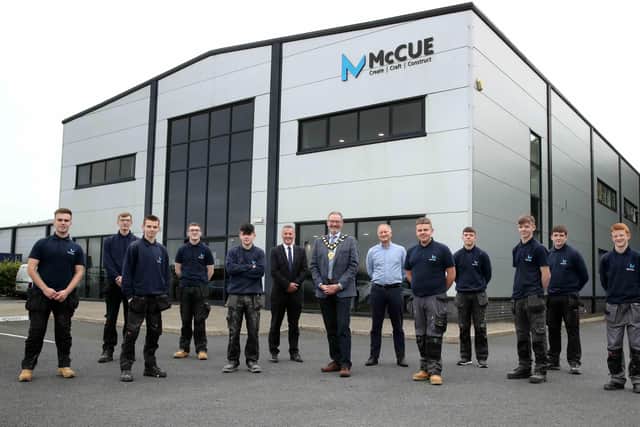Cllr William McCaughey with Graham Whitehurst MBE, Chair of the Mid and East Antrim Manufacturing Taskforce, Gary Purdy, managing director at McCue and the company’s latest intake of apprentices