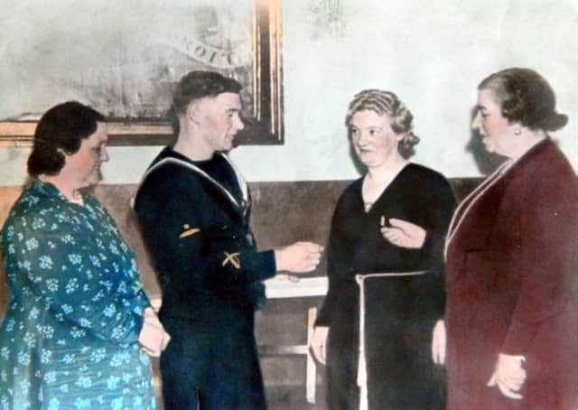 A presentation during the Second World War to Bobby McAtamney, who was on HMS Hardy and was one of the 'heroes of Narvik'