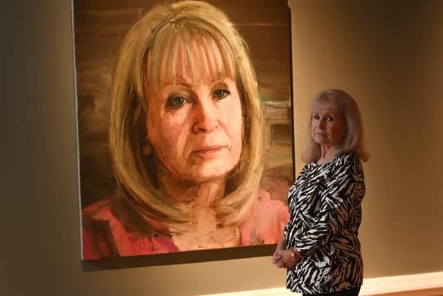 Mo Norton with her portrait