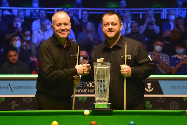 Mark Allen (right) with opponent John Higgins before securing success in the Northern Ireland Open final. Pic by Pacemaker.
