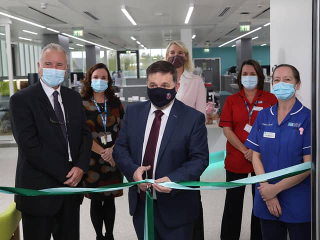 Health Minister Robin Swann opens the unit watched by (from left) Paul
