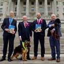 Pictured at the launch of the report is USPCA Chief Executive Brendan Mullan, MLA Robin Newton, Dr Marc Abraham OBE, and MLA John Blair