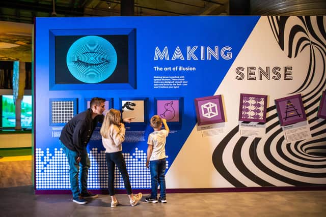 William, Poppy and Seth Drummond pictured in the Making Sense zone in the Reimagined W5