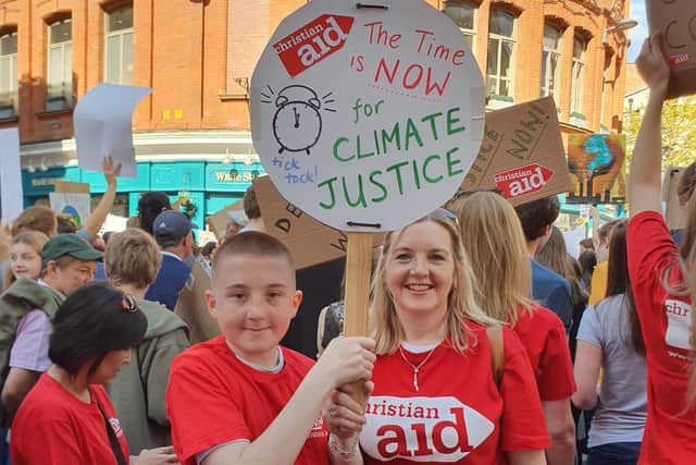 Rosamond Bennett with her son Reuben at a Climate Change rally in Belfast in 2019