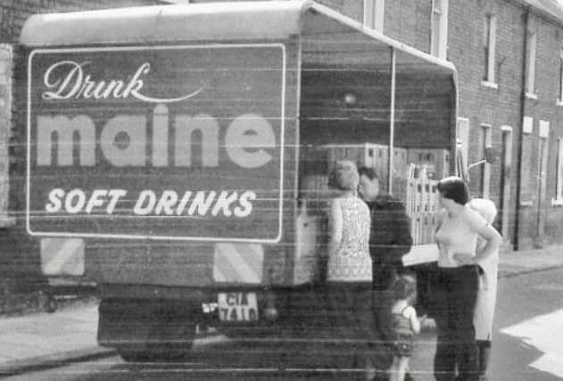 Customers standing at a Maine lorry on Harrisburg Street, off York Road in Belfast, around 1978