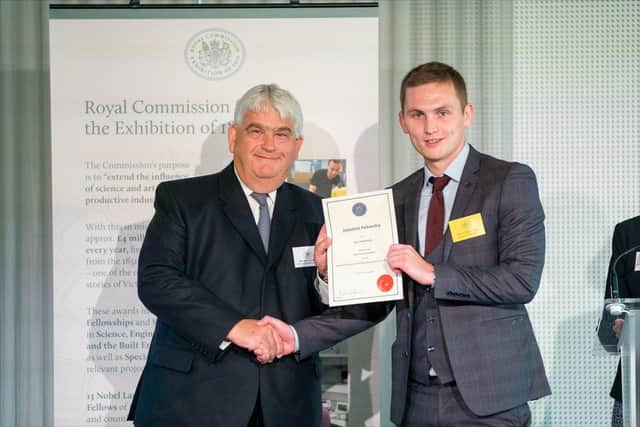 Daire O’Dubhthaigh with Bernard Taylor CBE, Chairman of the Royal Commission, being presented with his award at a ceremony in London