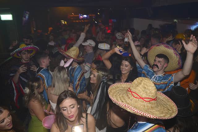 Nightclubs in Northern Ireland reopened on Sunday as some remaining coronavirus restrictions imposed last March are lifted.Venues across the rest of the UK and Republic of Ireland have already welcomed back customers. Halloween party goers pictured in Filthy McNastys nightclub in Belfast on Sunday night.Picture By:Pacemaker Press.