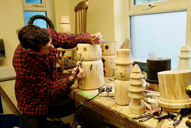 Adrian Boyd with crafted ornaments