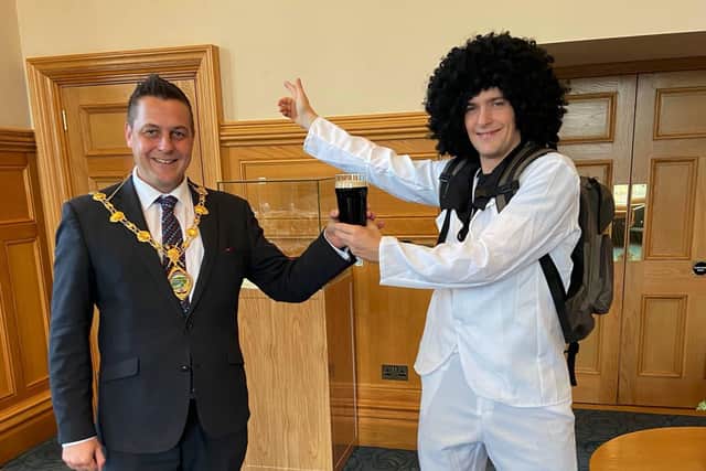 Fright fever: Derry and Strabane mayor Graham Warke greets Instagram sensation, skater Joe Hill to his parlour