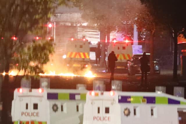 Missiles and fireworks being thrown at police on Lanark Way in the Loyalist Shankill Road area on Wednesday evening. Photo: Press Association
