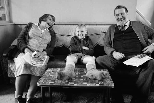 Dame Judi Dench, Jude Hill and Ciaran Hinds in a scene from the film ‘Belfast’