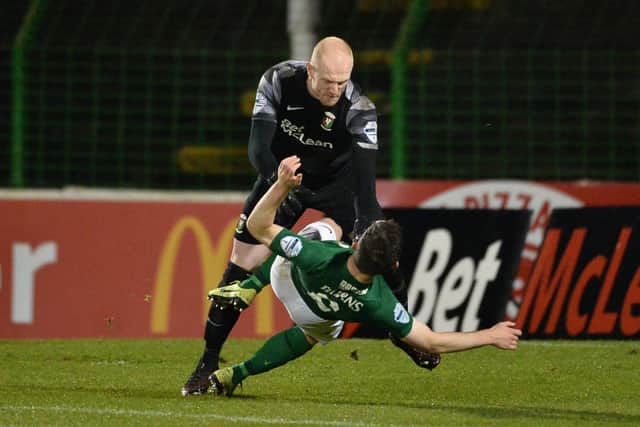 Aaron McCarey clashes with Glentoran teammate Bobby Burns during the 2-2 against Coleraine