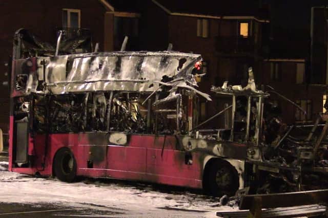 The burnt out double decker bus in Church Road near Rathcoole in Newtownabbey. Photo: David Young/PA Wire