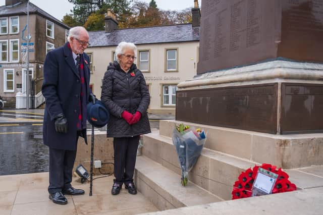 Enniskillen bomb survivor Jim Dixon and his wife Anna lay flowers at the cenotaph in the town, to mark the 34th anniversary of the atrocity, on 8 November 2021. Photo: Roy Crawford Photography.