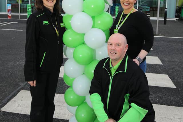 Helen Gault and Trevor Wilson, customer colleagues at Asda Ballyclare with general manager, Ursula Leonard