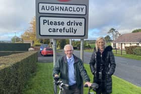Jim Copeland, 95, with MP Carla Lockhart in Aughnacloy, the last leg of his charity cycle for Charlene's project