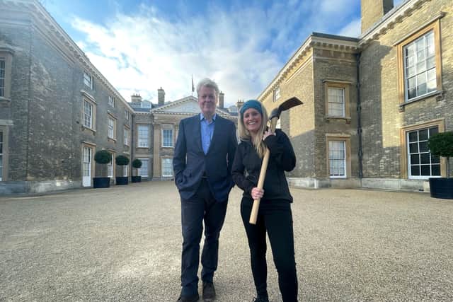 Archaeologist Cat Jarmen with pickaxe, and Charles Spencer outside Althorp House