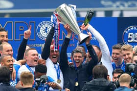 Rangers manager Steven Gerrard and his assistant Gary McAllister celebrate with the trophy after winning the Scottish Premiership at Ibrox Stadium, Glasgow.