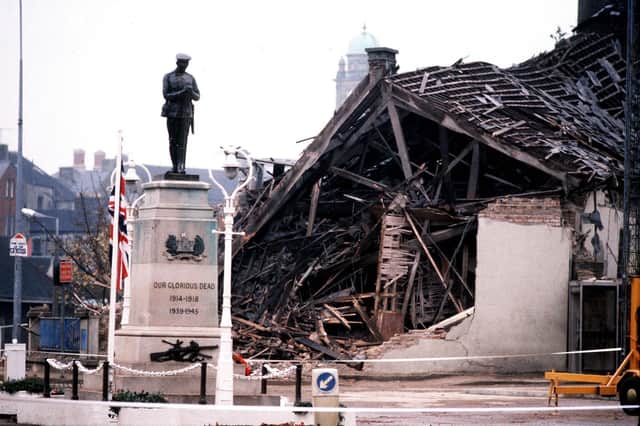 The scene in 1987. The Cenotaph at Enniskillen with the devastated community centre in the background