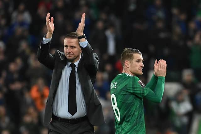 Northern Ireland manager Ian Baraclough and captain Steven Davis salute the home fans in Belfast following the 0-0 draw with European champions Italy. Pic by Pacemaker.