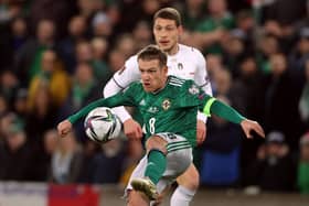 Northern Ireland's Steven Davis battling against Italy in Belfast. Pic by PA.