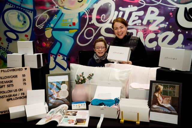 Maria O’Neill, founder of Pillowboxed, at her ‘pop-up’ stall in St George’s Market with her son Cillian O’Neill