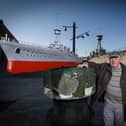 Billy Bingham with his model of the HMS Caroline beside the real thing