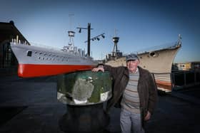 Billy Bingham with his model of the HMS Caroline beside the real thing