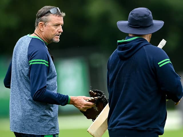 Ireland head coach Graham Ford, left, in conversation with Paul Stirling. Photo by Ramsey Cardy/Sportsfile.