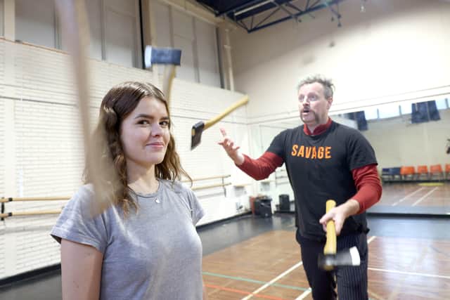 PACEMAKER, BELFAST, 11/11/2021: Belfast Newsletter reporter Neve Wilkinson looks a bit nervous during the axe juggling as she trains with Tina Segner and Ken Fanning for her Day at the Circus in the Vault Artist Studios in East Belfast .
PICTURE BY STEPHEN DAVISON