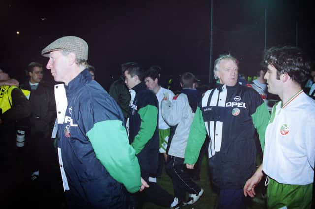 Republic of Ireland manager Jack Charlton (wearing cap) on the Windsor Park pitch following his team's 1-1 draw with Northern Ireland in November 1993. Photo: Pacemaker Belfast
