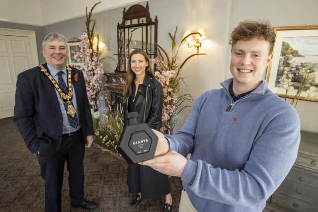 The Mayor of Causeway Coast and Glens Borough Council Councillor Richard Holmes pictured with James Richardson and Martha Gabe, the entrepreneurs behind the Basalt Distillery