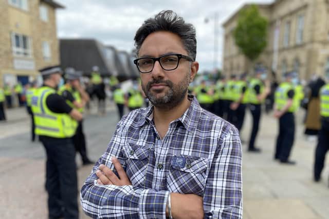Sathnam with police at Batley demonstration