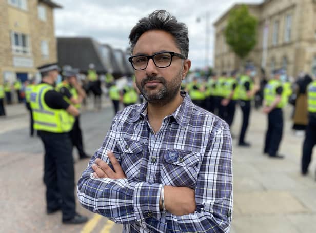 Sathnam with police at Batley demonstration
