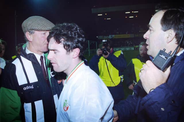 Alan McLoughlin (centre) with Republic of Ireland manager Jack Charlton (wearing cap) after his goal earns a 1-1 draw with Northern Ireland and World Cup qualification. Photo: Pacemaker Belfast