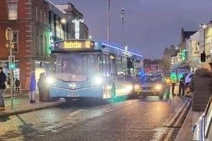 Bus and police car after collision in Portadown town centre during the Christmas Lights Switch On.