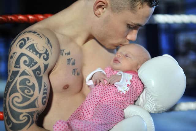 Carl, at 23, with his newborn daughter Carla, who will soon be 11. Picture by Russell Pritchard / Presseye